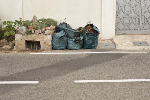 Commercial waste removal team outside a Belmont shop